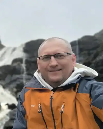 Ramunas, owner of Mini Moose, at a waterfall in Ireland